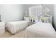 Cozy bedroom setup with two twin beds, decorated with stylish accents and lots of natural light at 4109 Vessel Ct, Kissimmee, FL 34746