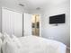 Bedroom with carpet flooring, a large TV mounted on the wall, and a closet for storage at 4109 Vessel Ct, Kissimmee, FL 34746