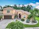 Stunning home with a tile roof, paver driveway, and a lush tropical landscaped yard at 4109 Vessel Ct, Kissimmee, FL 34746