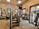 Well-equipped fitness center with modern machines, natural light, and ceiling fans at 4109 Vessel Ct, Kissimmee, FL 34746