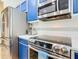 Close up kitchen view highlighting modern stainless steel appliances, countertops and tile backsplash at 4109 Vessel Ct, Kissimmee, FL 34746