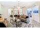 Open living room with elegant chandelier, neutral decor, and archways that add architectural detail at 4109 Vessel Ct, Kissimmee, FL 34746