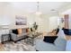 This living room has a modern chandelier and neutral decor for a bright, inviting space at 4109 Vessel Ct, Kissimmee, FL 34746
