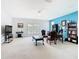 Spacious office room with ample lighting, a desk, a bookcase, and a comfortable seating area at 4109 Vessel Ct, Kissimmee, FL 34746