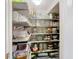 Pantry featuring an abundance of shelving with various kitchenware and household goods at 4109 Vessel Ct, Kissimmee, FL 34746