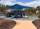 Colorful community playground with slides, swings, and a shaded area at 4109 Vessel Ct, Kissimmee, FL 34746
