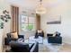Cozy sitting area with a large window, modern decor, and a plush rug at 4109 Vessel Ct, Kissimmee, FL 34746