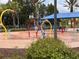 A colorful splash pad with various water features provides a fun and interactive space for to cool off at 4109 Vessel Ct, Kissimmee, FL 34746