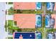 Aerial view of neighborhood homes with pools, tile roofs, manicured lawns, and proximity to street and green spaces at 423 Paloma Dr, Davenport, FL 33837