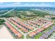 Expansive aerial view of a vibrant residential community with well-maintained homes and lush green spaces at 423 Paloma Dr, Davenport, FL 33837