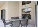 Covered patio area with outdoor dining set and view of the yard at 423 Paloma Dr, Davenport, FL 33837