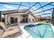 Wonderful screened-in pool and patio area with lounge chairs and a dining table at 423 Paloma Dr, Davenport, FL 33837