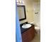 Bathroom featuring a sink with dark countertop and a tiled shower/bath combination at 429 Fountainhead Cir # 223, Kissimmee, FL 34741