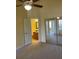 Bright bedroom featuring a ceiling fan, neutral carpeting, and mirrored closet doors at 429 Fountainhead Cir # 223, Kissimmee, FL 34741