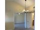 A chandelier hangs in the dining area, showcasing the seamless transition to other spaces at 429 Fountainhead Cir # 223, Kissimmee, FL 34741