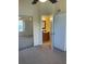 Hallway featuring a view of a vanity and mirror at 429 Fountainhead Cir # 223, Kissimmee, FL 34741