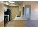 Kitchen with breakfast bar flowing into living area at 429 Fountainhead Cir # 223, Kissimmee, FL 34741