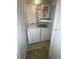 A view of the laundry room, including a washer, dryer and water heater at 429 Fountainhead Cir # 223, Kissimmee, FL 34741