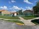 Tennis court featuring well-maintained surface and surrounded by lush greenery for an active lifestyle at 429 Fountainhead Cir # 223, Kissimmee, FL 34741