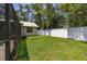 Well-maintained backyard featuring lush green grass, privacy fence, and a charming shed for extra storage at 4307 Oak Ct, St Cloud, FL 34769
