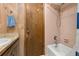 Bathroom with shower-tub combination with pink tile and vintage fixtures at 4307 Oak Ct, St Cloud, FL 34769