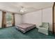 Bedroom with a ceiling fan and a large window for ample natural light at 4307 Oak Ct, St Cloud, FL 34769