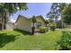 Landscaped yard with well maintained lawn surrounds the home at 4307 Oak Ct, St Cloud, FL 34769