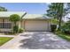 Spacious two-car garage with ample driveway space, perfect for parking and outdoor activities at 4307 Oak Ct, St Cloud, FL 34769