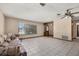 Open living room featuring tile floors, large window, and a view of the entry at 4307 Oak Ct, St Cloud, FL 34769