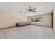 Spacious living room showcasing tile floors, light walls, and lots of natural light at 4307 Oak Ct, St Cloud, FL 34769