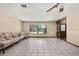 Bright living room with tile flooring, a ceiling fan, and a large window at 4307 Oak Ct, St Cloud, FL 34769