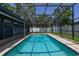 Screened-in pool with clean water and surrounding patio, ideal for outdoor enjoyment at 4307 Oak Ct, St Cloud, FL 34769