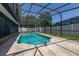 Screened-in pool with a ladder, a tiled edge, and surrounding patio space at 4307 Oak Ct, St Cloud, FL 34769