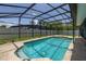 A stunning screened-in pool with plenty of space for outdoor enjoyment and surrounded by lush landscaping at 4307 Oak Ct, St Cloud, FL 34769