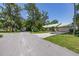 Street view of a well-maintained home with a spacious driveway and green lawn at 4307 Oak Ct, St Cloud, FL 34769