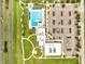 Aerial view of the community pool, clubhouse, and parking lot at 440 Peppermill Cir, Kissimmee, FL 34758