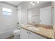 Bright bathroom with granite countertops, white cabinets and shower at 440 Peppermill Cir, Kissimmee, FL 34758