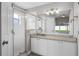 Bathroom featuring granite countertops, shower and lots of light at 440 Peppermill Cir, Kissimmee, FL 34758