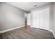 Bedroom featuring wood laminate flooring, neutral paint and a closet at 440 Peppermill Cir, Kissimmee, FL 34758