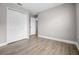 Clean bedroom with wood laminate flooring and a large closet at 440 Peppermill Cir, Kissimmee, FL 34758
