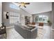 Cozy living room features tile floors, high ceilings, and bright windows at 440 Peppermill Cir, Kissimmee, FL 34758
