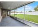 Screened patio showcasing a spacious backyard with new white fencing at 440 Peppermill Cir, Kissimmee, FL 34758