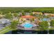 Aerial view showcasing community amenities, including a pool, clubhouse, and recreational areas at 4697 Golden Beach Ct, Kissimmee, FL 34746