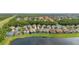 Aerial view showcasing homes with screened pools near a tranquil lake, highlighting the community's amenities and location at 4697 Golden Beach Ct, Kissimmee, FL 34746