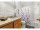 Bright bathroom with a bathtub, shower, and a vanity sink at 4697 Golden Beach Ct, Kissimmee, FL 34746