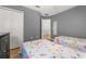 Bedroom with two twin beds, wood-look floors, closet and view to the stairs at 4697 Golden Beach Ct, Kissimmee, FL 34746