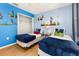 Bright bedroom featuring themed decor, and hardwood flooring at 4697 Golden Beach Ct, Kissimmee, FL 34746