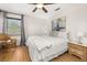 Comfortable bedroom featuring a cozy chair, light walls, and neutral toned decor at 4697 Golden Beach Ct, Kissimmee, FL 34746