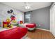 Themed bedroom with two beds, wood-look floors, and a ceiling fan at 4697 Golden Beach Ct, Kissimmee, FL 34746