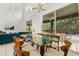 Open-concept dining area with a view of the pool, bright lighting, and living area at 4697 Golden Beach Ct, Kissimmee, FL 34746